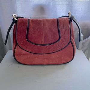 Red leather handbag over the shoulder